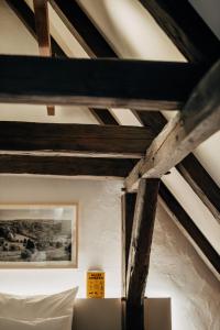 a ceiling with wooden beams in a room at Bootshaus Amberg in Amberg