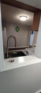 a kitchen with a sink and a faucet at Picon Homey in Springfield