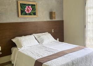 Postel nebo postele na pokoji v ubytování Pousada Larissa POSSUIMOS GERADOR
