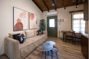 a living room with a couch and a table at Bodrum Suites in Ioannina