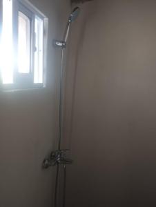 a shower in a bathroom with a window at Cabañas Raysa y Alejandro Pasion #3 in Las Galeras