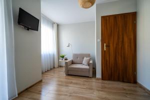 TV a/nebo společenská místnost v ubytování VERTUS