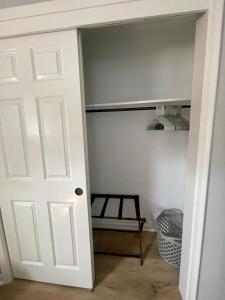 a door leading into a closet with a shelf at Cathedra 3l-Charming Apartment walk to UNMC in Omaha
