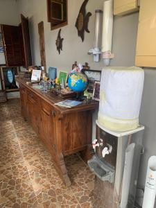 a room with a counter with a globe on it at SUITES Recanto do DO Mar in Saquarema