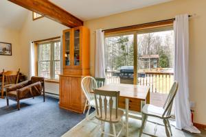 a dining room with a table and chairs and a window at Lake Wallenpaupack Summer Getaway with Pool Access! in Lake Ariel