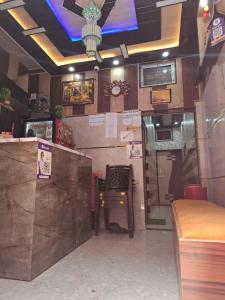 a restaurant with a bar with a table in it at सुभद्रा guest house in Ayodhya