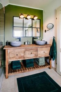 a bathroom with two sinks and a large mirror at Cottage Salzburg in Nußdorf am Haunsberg +37 photos