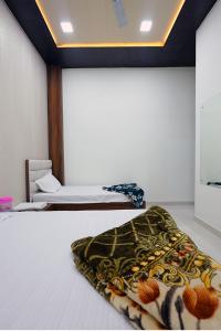 a bedroom with two beds at Shiv Residency in Mathura
