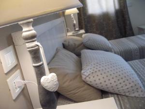 Postel nebo postele na pokoji v ubytování B&B Borgo Arcadia