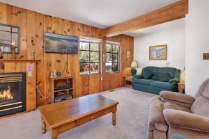 a living room with a couch and a fireplace at JUS' RESTIN #265 in Big Bear Lake
