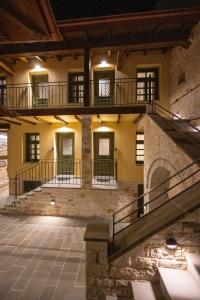 an empty room with stairs in a building at Bodrum Suites in Ioannina