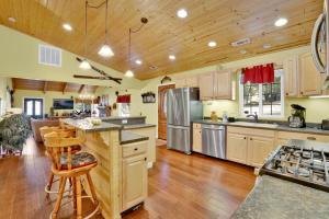 a large kitchen with wooden floors and wooden ceilings at Lazy bear lodge #1235 in Big Bear Lake