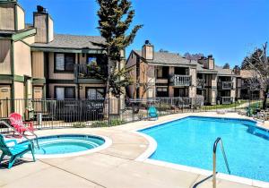 a swimming pool in a courtyard with houses at Boulder creek #1412 in Big Bear Lake