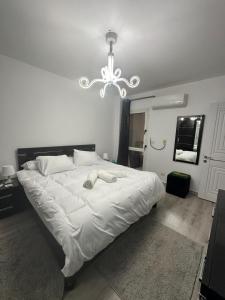 Postel nebo postele na pokoji v ubytování Madinaty Relaxation