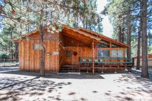 a wooden cabin in the middle of a forest at Avalon hide out #1336 in Big Bear Lake