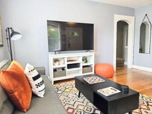 a living room with a couch and a coffee table at Dundee Escape in Charleston