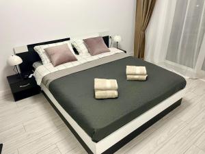 Voodi või voodid majutusasutuse Wald Central Residence toas