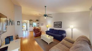 a living room with a couch and a table at Magnolia Run 16 2BR 2BA in Pawleys Island