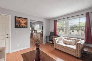 a living room with a couch and a table at Tranquil 2BR Apt Mpls - 8075 Apt 3 in Minneapolis