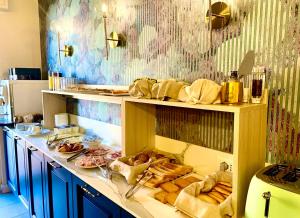 a kitchen with a counter with different types of food at I Tre Re in Bardolino