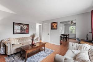 a living room with two couches and a table at Tranquil 2BR Apt Mpls - 8075 Apt 3 in Minneapolis