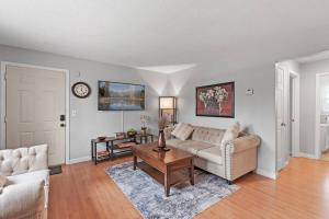 a living room with a couch and a table at Tranquil 2BR Apt Mpls - 8075 Apt 3 in Minneapolis