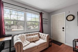 a living room with a couch and a window at Tranquil 2BR Apt Mpls - 8075 Apt 3 in Minneapolis