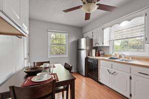 a kitchen with a table and a ceiling fan at Tranquil 2BR Apt Mpls - 8075 Apt 3 in Minneapolis