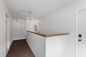 an empty hallway with a counter in a room at Tranquil 2BR Apt Mpls - 8075 Apt 3 in Minneapolis