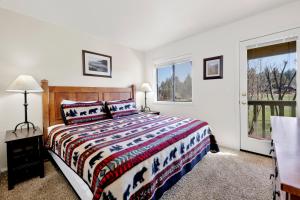 a bedroom with a bed and a window at Sunny side up #1343 in Big Bear Lake
