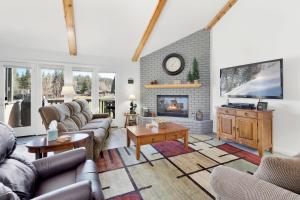 a living room with couches and a fireplace at Sunny side up #1343 in Big Bear Lake