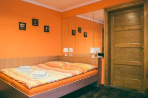 A bed or beds in a room at Sokolovna