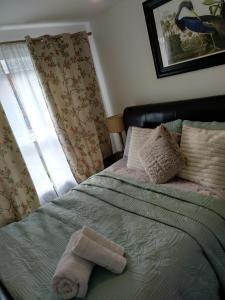 Una cama o camas en una habitación de House Rose