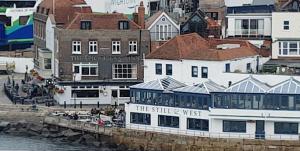 a group of buildings next to a body of water at Portsmouth House near Centre 3 Bedrooms in Portsmouth