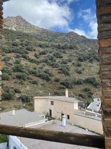 a view of a mountain from a house at CASA EL RÍO in Trevélez