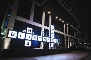 a building with a sign that says bordelon benoitoit at Blu Monkey Hub and Hotel Phuket Town- Free All Day Coworking space in Phuket Town