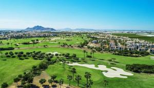 an aerial view of a golf course at a resort at Casa Jansiver - 450m de la playa, céntrica pero tranquila in Los Alcázares