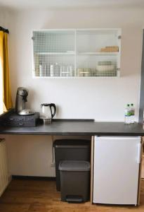a kitchen with a counter top with a appliance at Ferienwohnung Am Bollenbach in Idar-Oberstein
