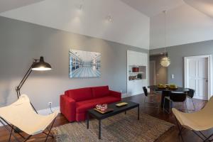 a living room filled with furniture and a couch at Oporto Serviced Apartments - 1858 in Porto