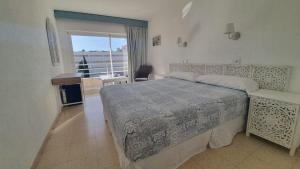 Postel nebo postele na pokoji v ubytování Hostal Roberto