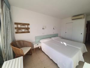 Postel nebo postele na pokoji v ubytování Hostal Roberto