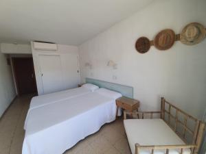 Postel nebo postele na pokoji v ubytování Hostal Roberto