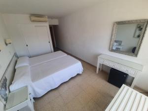Postel nebo postele na pokoji v ubytování Hostal Roberto