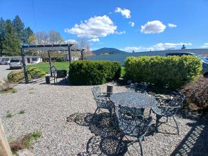 a patio with a table and chairs and a swing at Silver Lakes Inn in Hayden