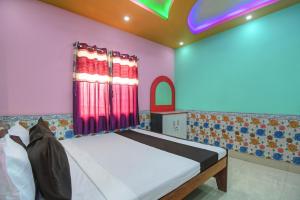 Voodi või voodid majutusasutuse OYO Yuvraj Lodge And Hotel toas