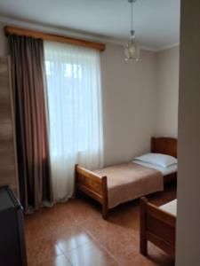 Voodi või voodid majutusasutuse Tornado Hotel toas