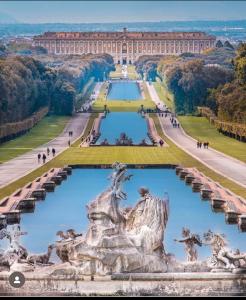 a view of the palace of versailles from the palace of versailles gardens at Maison Number11 in Caserta