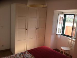 Ένα ή περισσότερα κρεβάτια σε δωμάτιο στο Casa Azenhas Mar