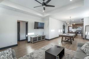 a living room with a couch and a table at Downtown Chattanooga that Sleeps 8 with a Pool Table in Chattanooga