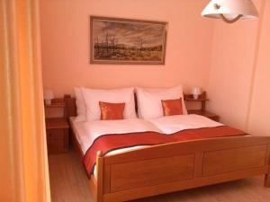 Letto o letti in una camera di Pension VIDHOUS 1